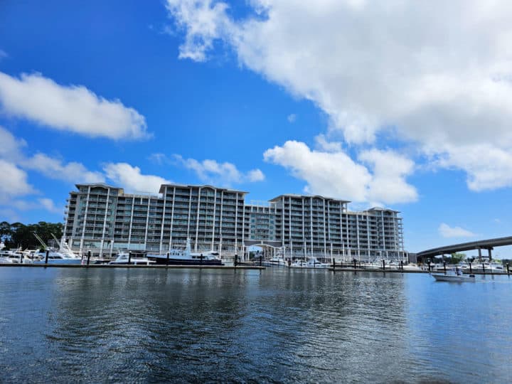 Looking over the water to the Wharf Marina with large condo building behind it