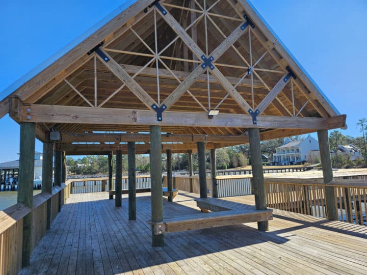 Wooden covering and benches at the end of Orange Beach waterfront park pier
