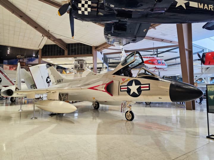 Fighter jet with the cockpit open, blue and white star on the side of the plane