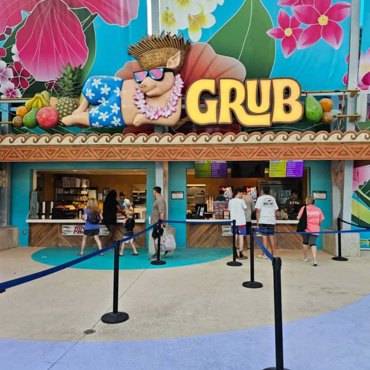 Grub restaurant sign with tropical pig and flowers