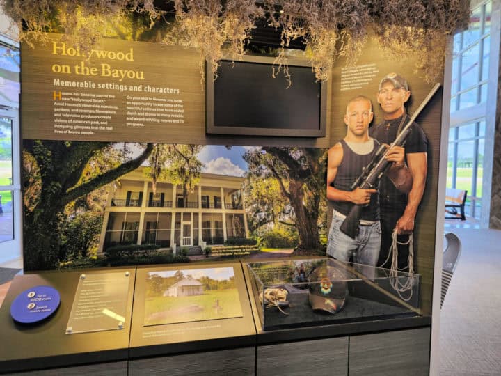Hollywood in Houma display with Swamp people, plantation building, and moss