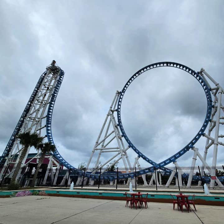 Blue roller coaster with drop into a 360 loop
