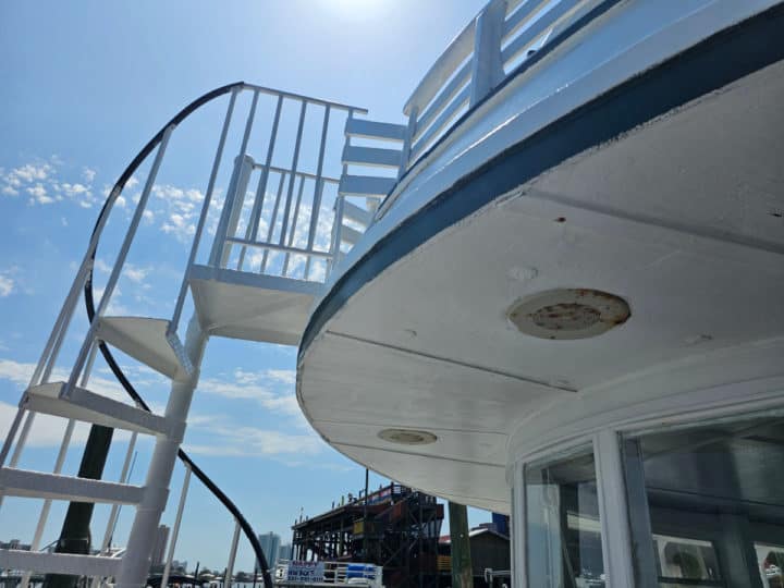 outdoor spiral staircase to top level of a boat