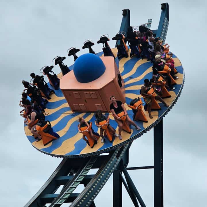Large circular amusement park ride on a wave track