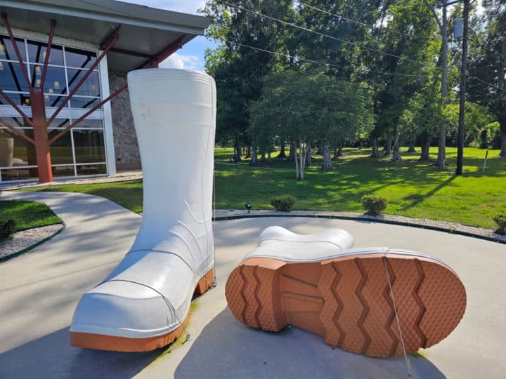 Large white boots sculpture in front of Houma Visitor Center