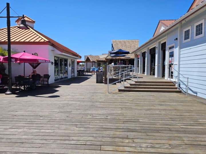 wooden boardwalk between stores 