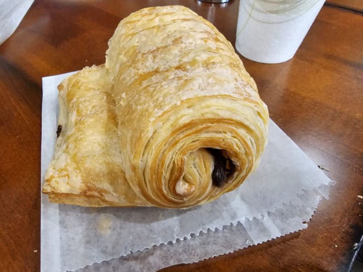 Chocolate croissant on a paper bag
