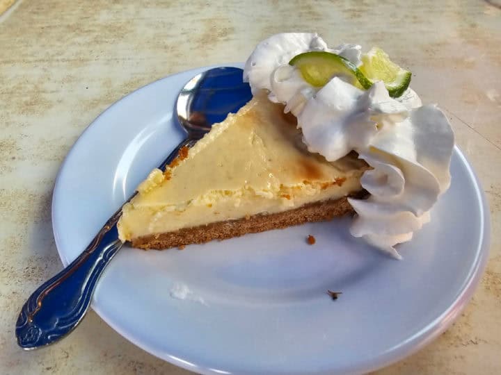 key lime pie on a plate with a spoon