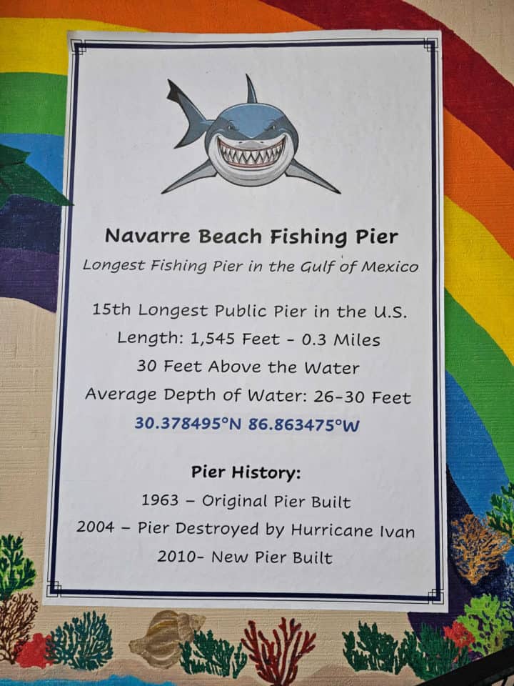 Navarre Beach Fishing Pier Facts on a white piece of paper with a shark image