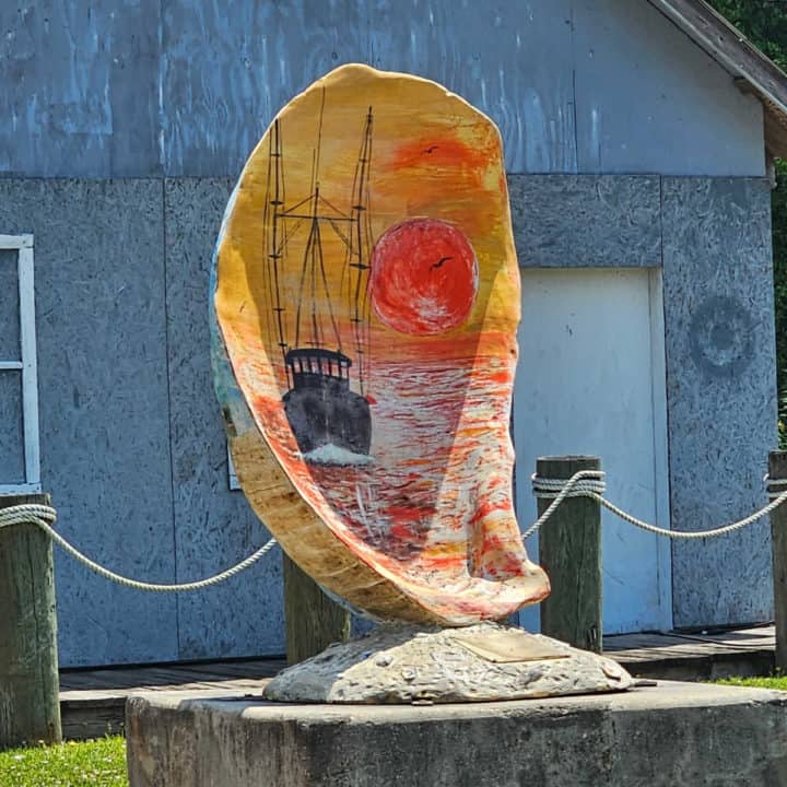 Large Painted oyster shell with a shrimp boat on it