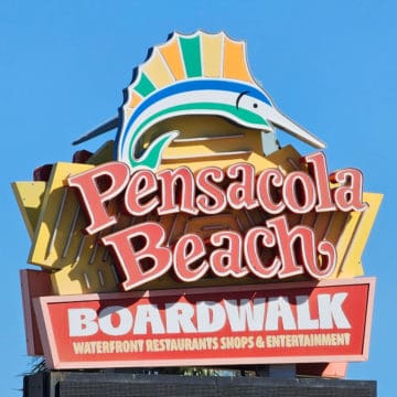 Pensacola Beach Boardwalk sign with fish on top