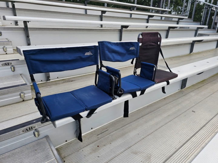 Bleacher chairs on bleachers with other rows in the picture