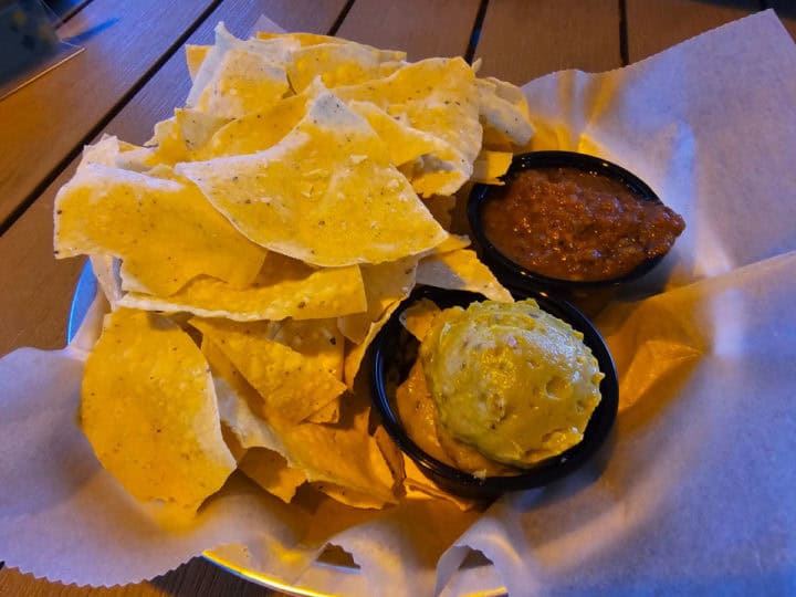 Chips and salsa in a paper lined bowl 