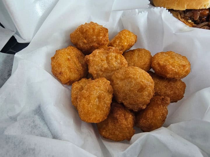 Corn nuggets in a paper lined container. 