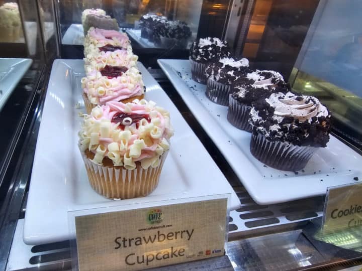 cupcakes on display in a bakery case