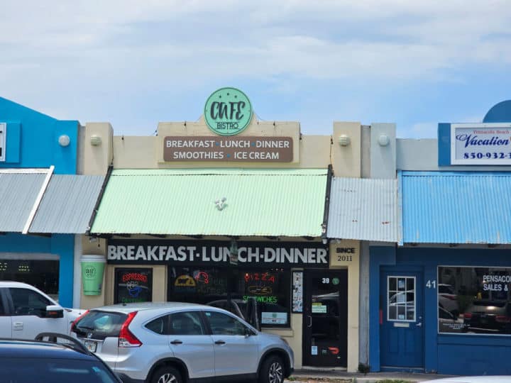 building exterior with Cafe Bistro sign and breakfast, lunch and dinner