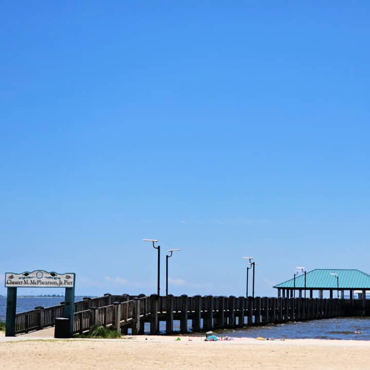 pier going out onto the water with a Chester M McPhearson Jr Pier sign