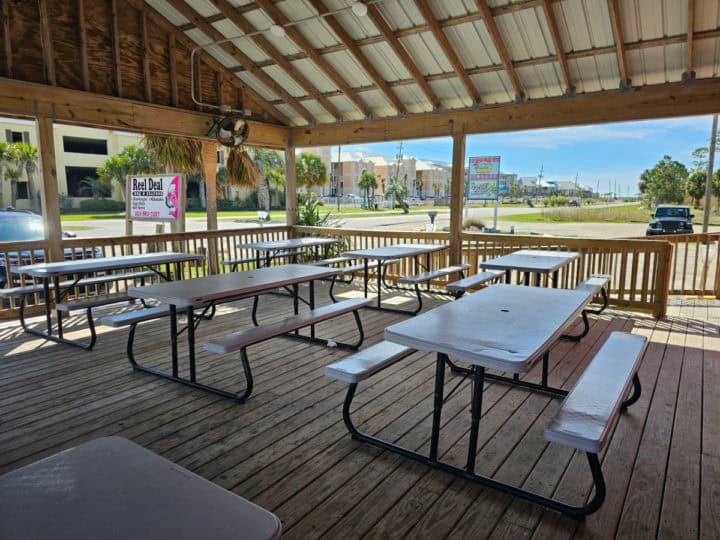 outdoor seating picnic tables under a roof