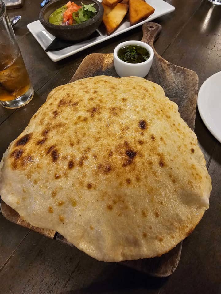 bread next to a small bowl of olive oil