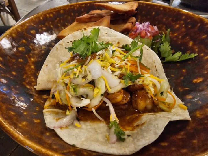 shrimp taco in a brown bowl