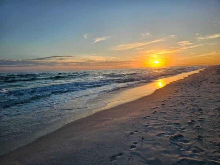 sunset over the Gulf and Navarre Beach from the shoreline. 