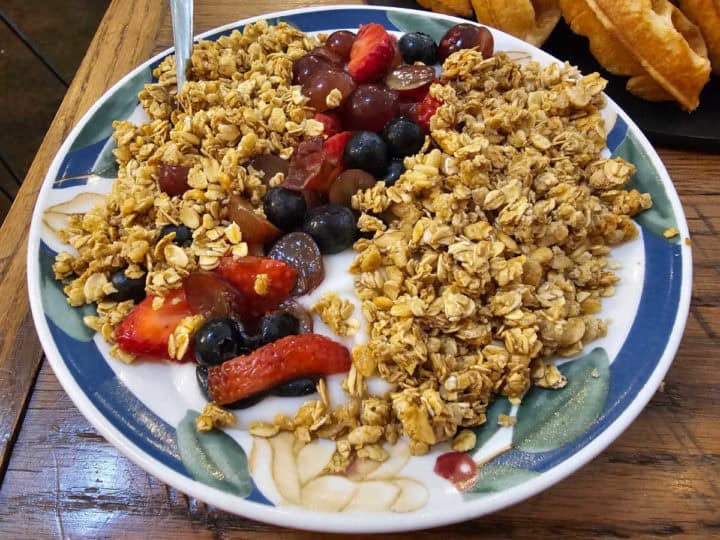 Fruit and granola bowl with yogurt on a table