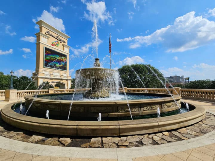 large outdoor fountain near Beau Rivage sign