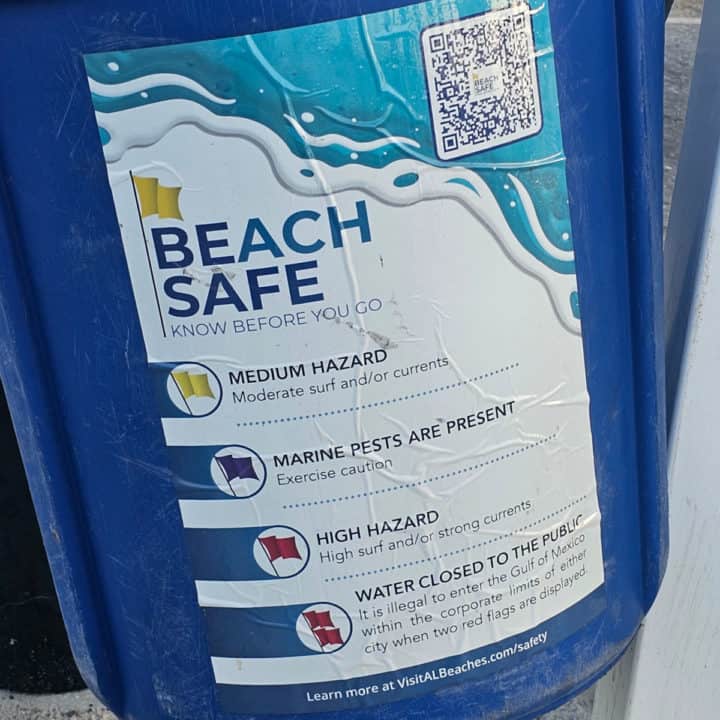 beach safe info on a blue garbage can