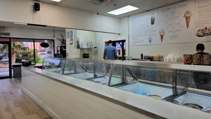 Ice cream display counter with menu behind it in Del's Ice Cream