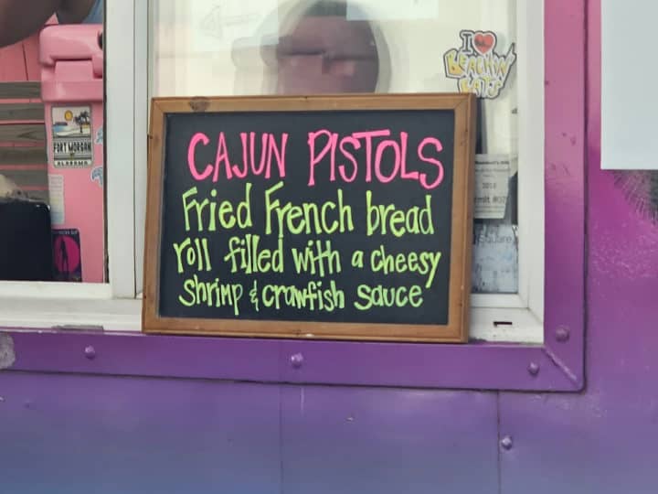 Cajun Pistols on a chalk board with description