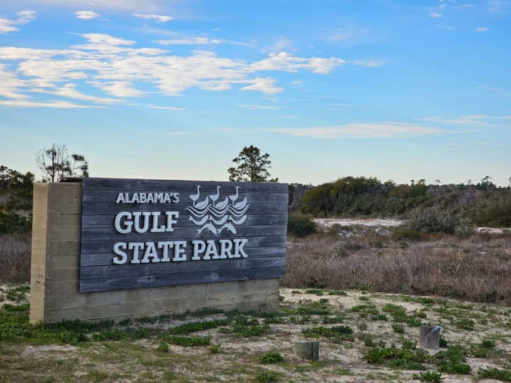 Alabama's Gulf State Park entrance sign with blue skies in the background