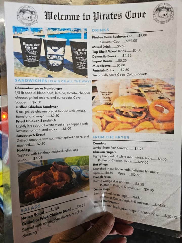 Pirates Cove Menu with photos of bushwackers, burgers and sandwiches