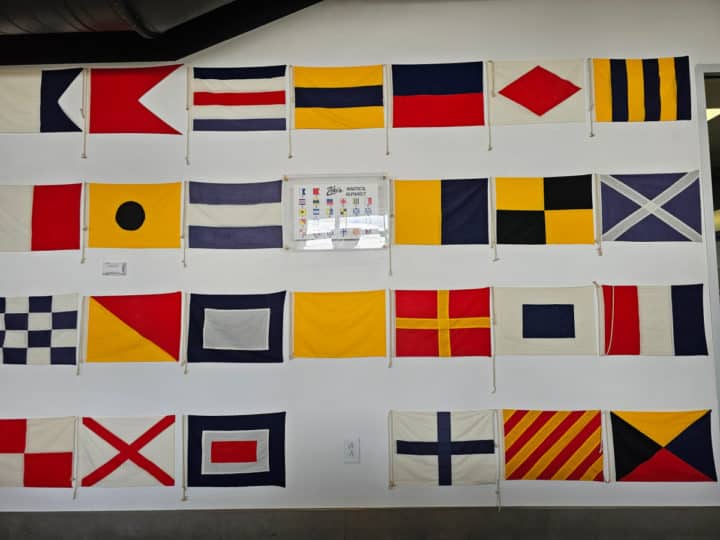 nautical flags with a Zeke's Nautical Alphabet sign