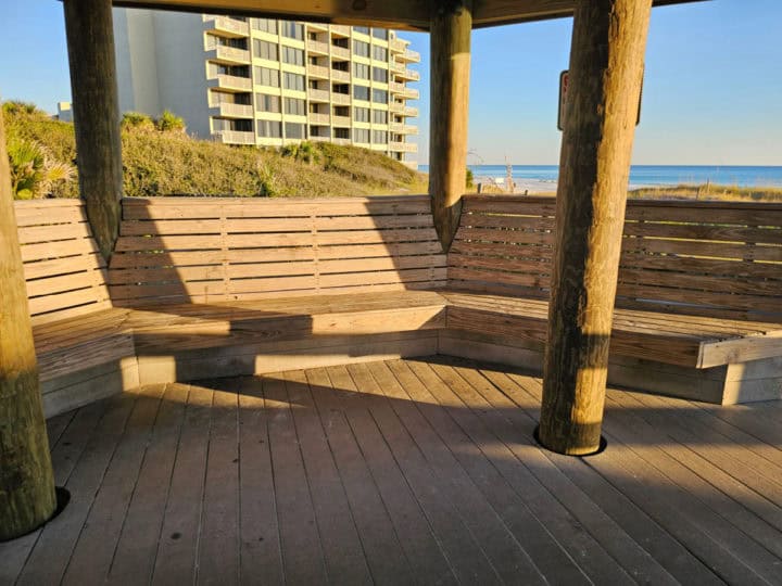 wooden benches lining a gazebo