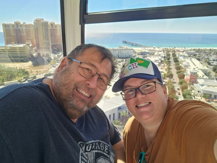 John and tammilee in the skywheel gondola with Gulf of Mexico in the background