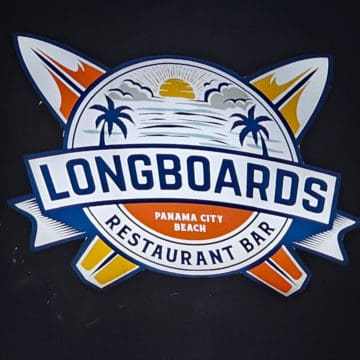 Longboards Restaurant Bar Panama City Beach logo with surfboards