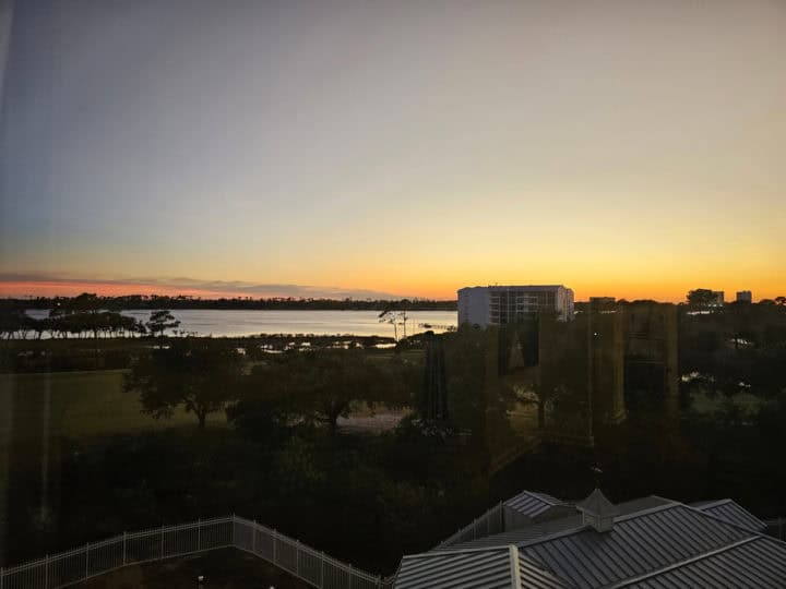 sunset sky over water and condo buildings