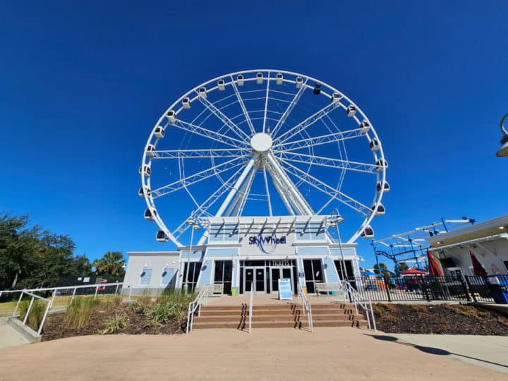 Panama City Beach skywheel with stairs leading up to the ticket entrance on a sunny day