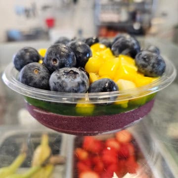 Acai bowl with blueberries and mango chunks