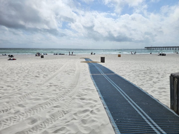 accessibiity mat down the white sand of Casino Beach