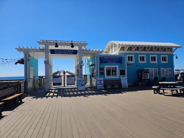 Blue building with gate entrance to the Russell Fields Pier