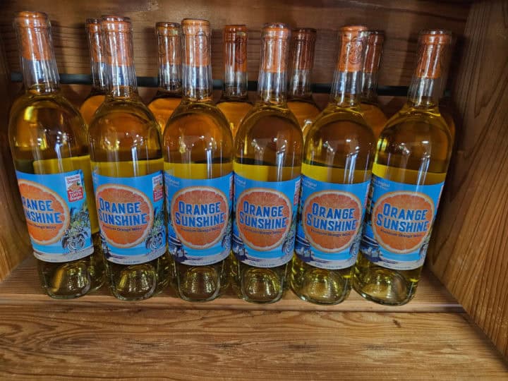 Orange Sunshine Wine bottles in a wooden crate