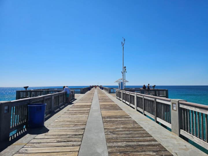 wooden and concrete pier looking down towards the end