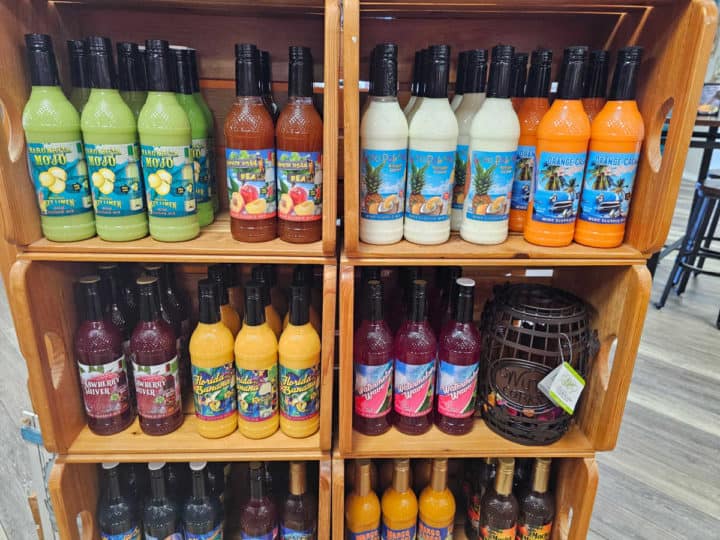 Wine slushie mixes on display in wooden crates