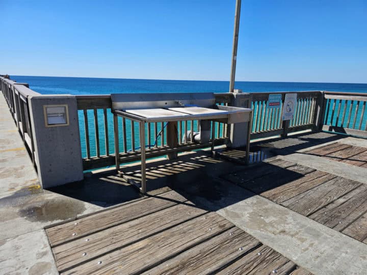 Fish cleaning station on the pier looking out to the Gulf of Mexico