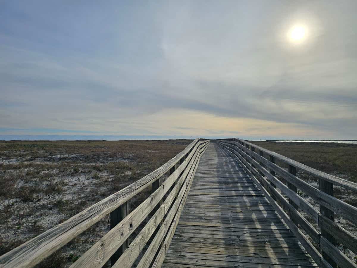 Wooden boardwalk out to the sand