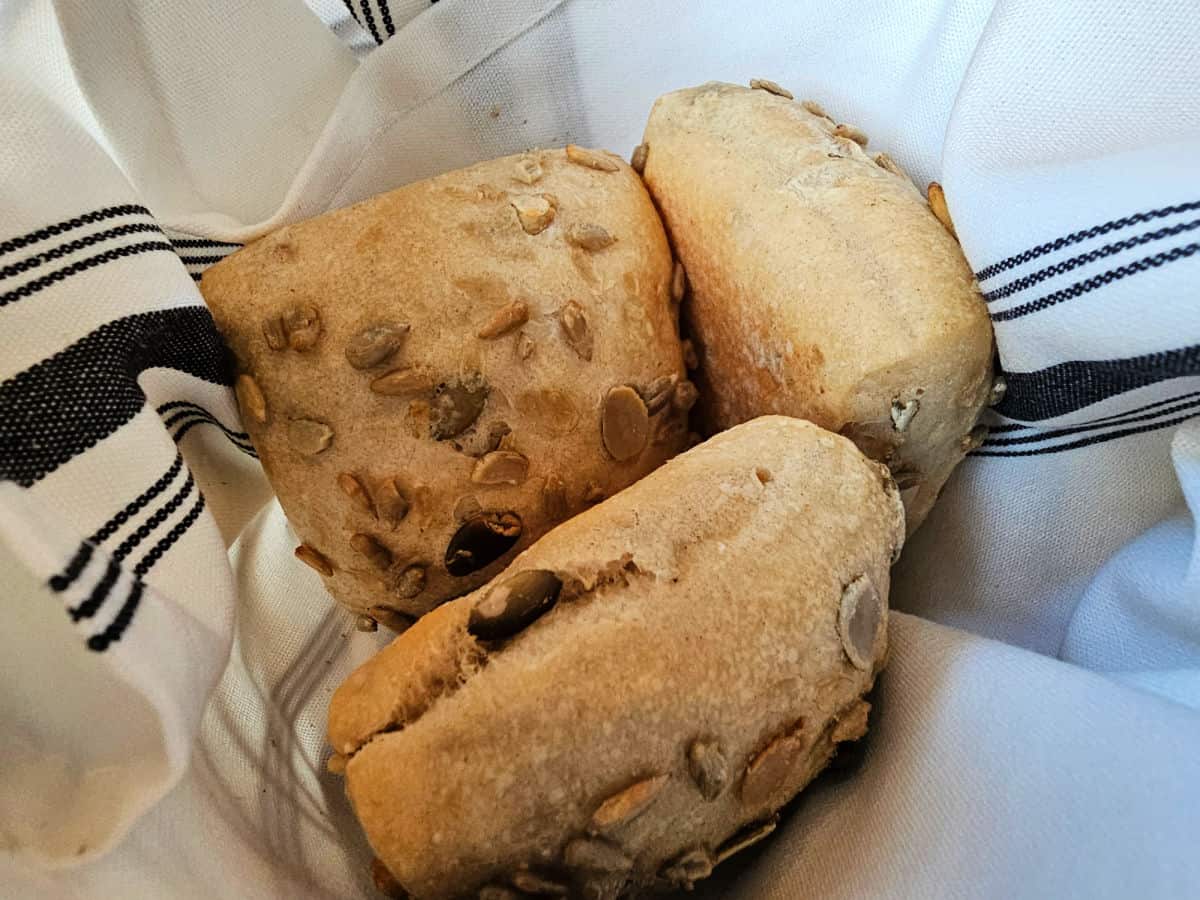 Rolls with seeds in a linen basket