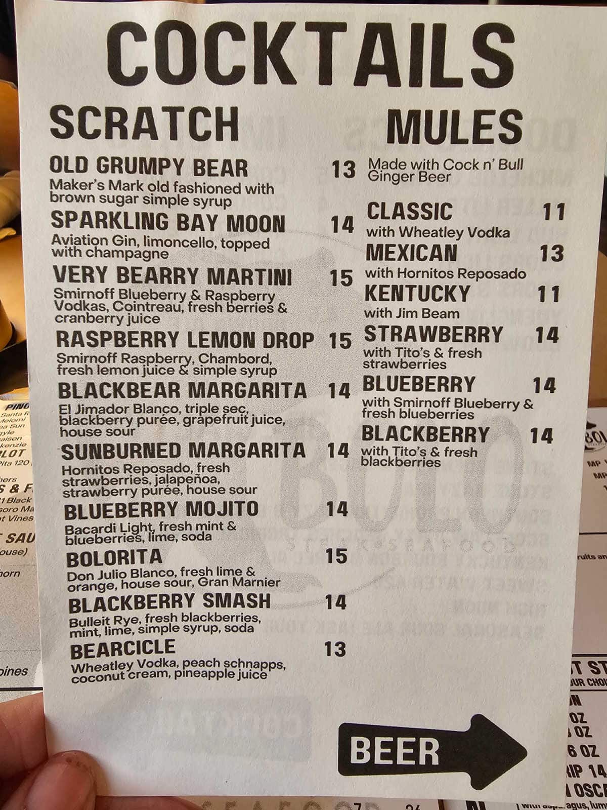 Cocktails scratch and mules on a white paper menu