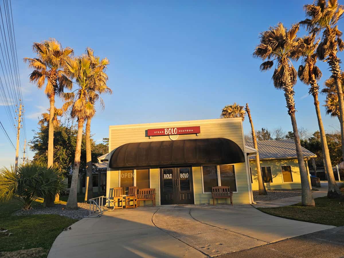 BOLO Steak Seafood sign over a dark awning and two entrance doors