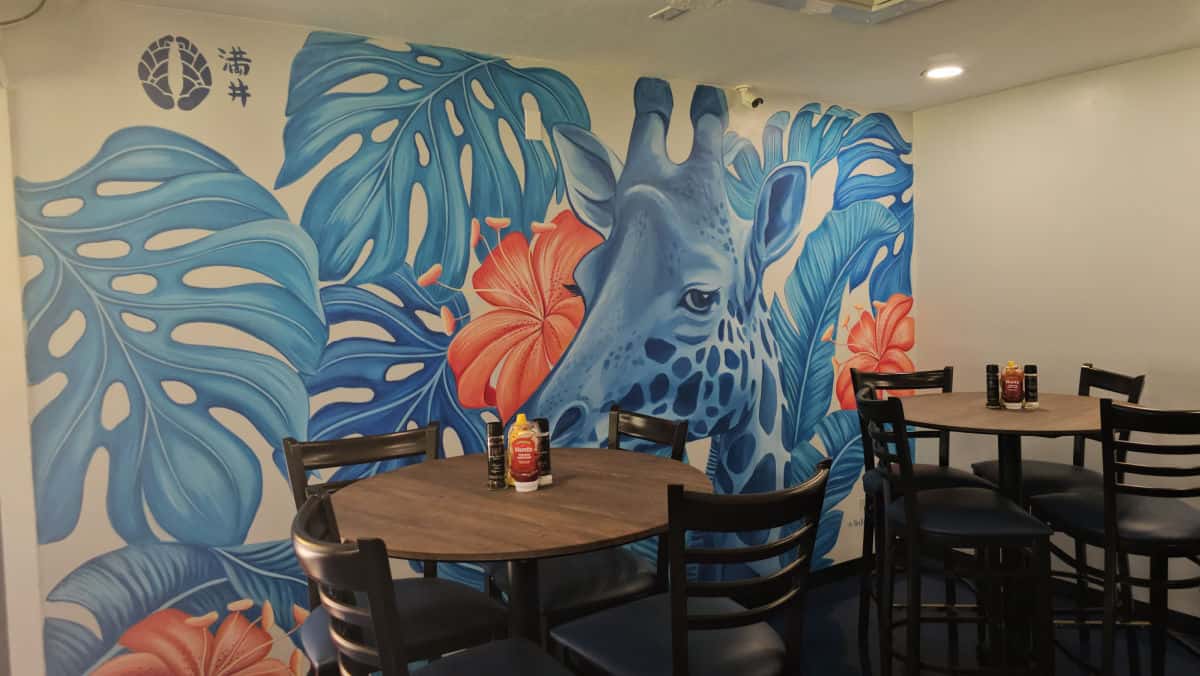Blue Giraffe Mural with pink hibiscus
